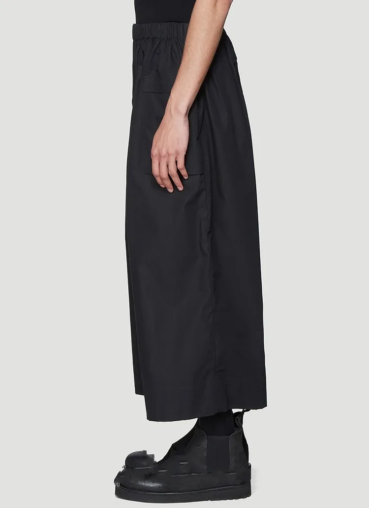 De nieuwe zomer herenmode rechte broek in pure kleur, bijpassende casual losse wijde pijpen broek met grote zak butt plakken