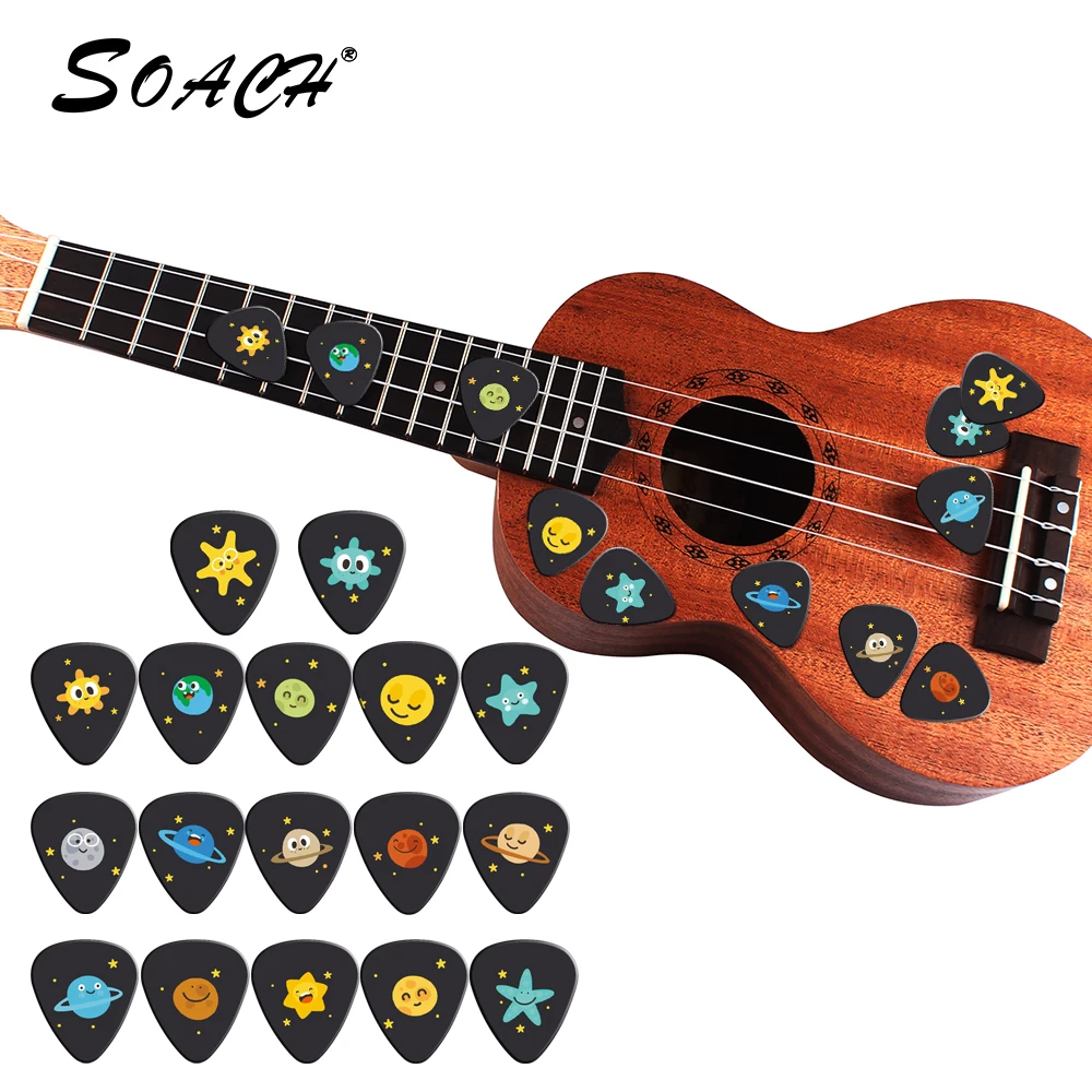 Soach 10 pçs/lote 0.71mm espessura dos desenhos animados vastidão do universo estrela picaretas de guitarra padrão cinta guitarra peças guitarra acc