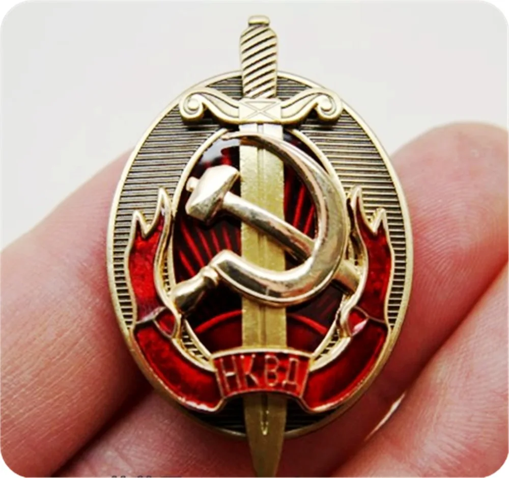 NKVD multilayer copper enamel shield and sword badge of the early KGB interior ministry