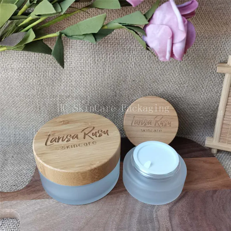 

Customized engraving logo sample 50g 100g Biodegradable Wooden Cream jars Bamboo matte glass cream jar pot Cosmetic Packaging