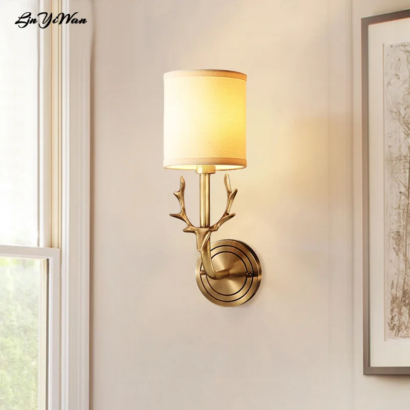 

Copper American country deer head wall lamp living room bedroom bedside wall lamp mirror headlight single antler wall lamp.