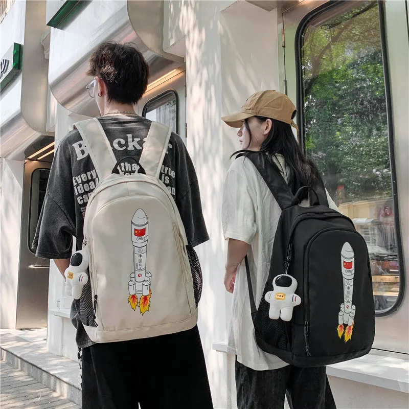 Kawaii Cute Cartoon Rocket Pattern Backpack Unisex and Large Capacity Student Couple Schoolbag To Send Doll Pendant