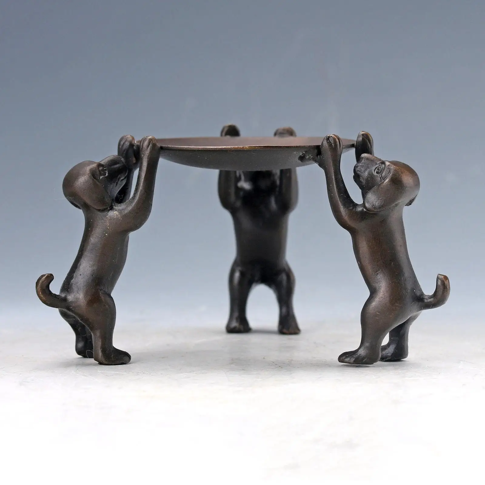 

Chinese Old Bronze Handmade dogs Plate Statue Oil Lamp Candlestick