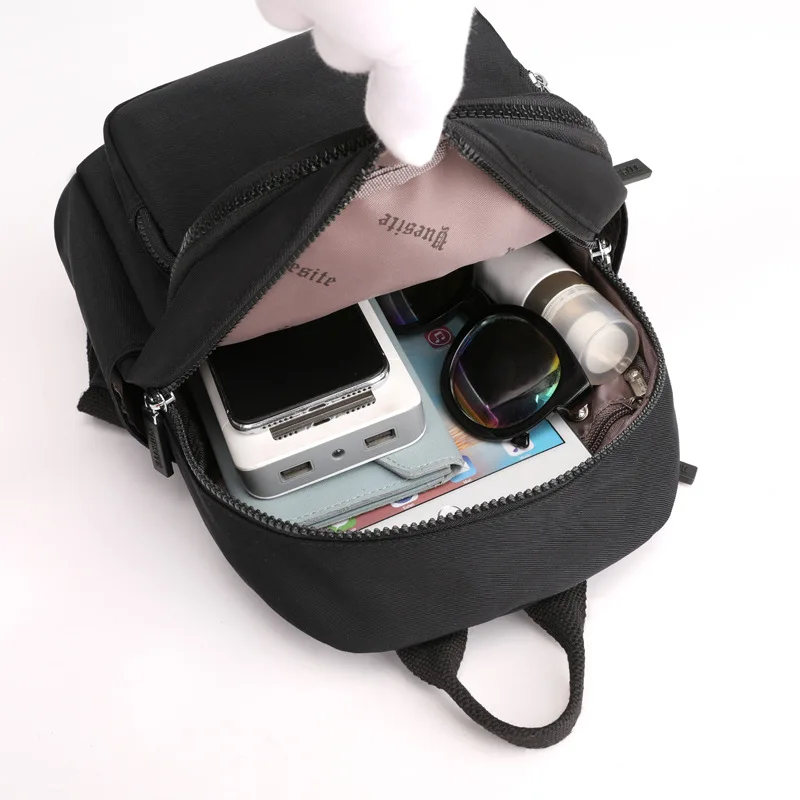 Mochila impermeable de ocio para mujer, morral femenino de moda, morral pequeño de viento para Universidad, bolso de viaje multifunción para niña
