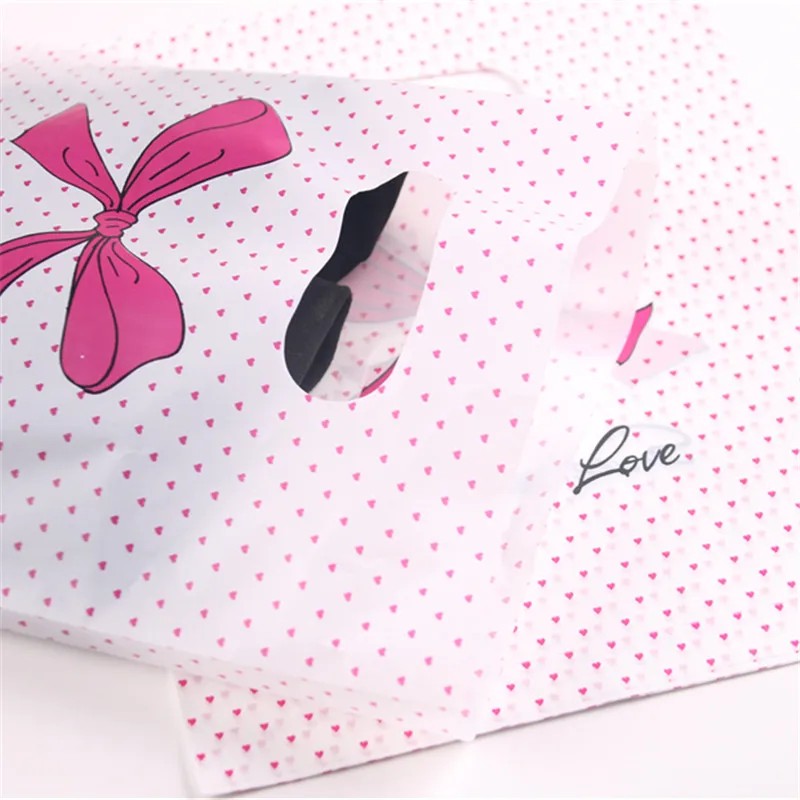 New Design Wholesale 100pcs/lot 20*25cm Pink Sweet Love Packaging Bags For T-shirt Plastic Shopping Bags With Dot Bow