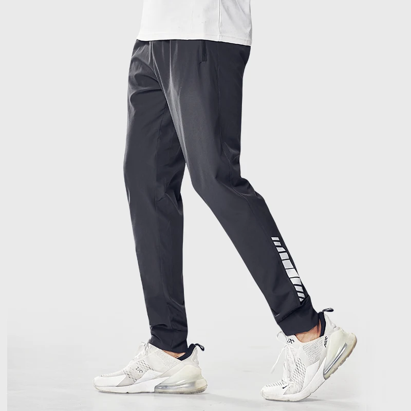 Pantaloni sportivi da uomo pantaloni da corsa con tasche con cerniera allenamento e Jogging pantaloni da uomo pantaloni da palestra per uomo