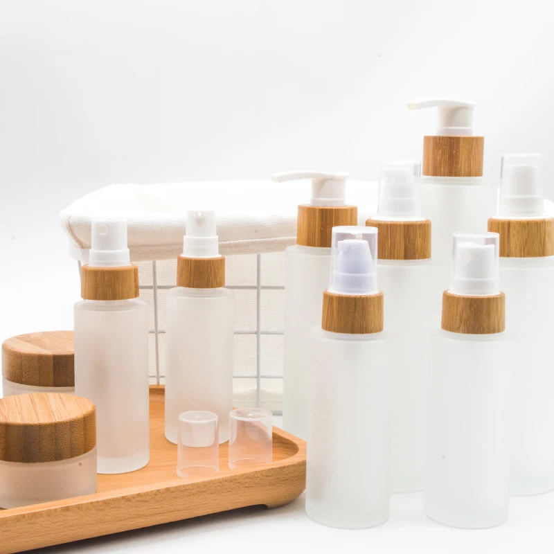 Wholesales Full Carton of Luxury Empty Cylinder Cosmeticos Frosted Serum Glass Bottle With Bamboo Cap