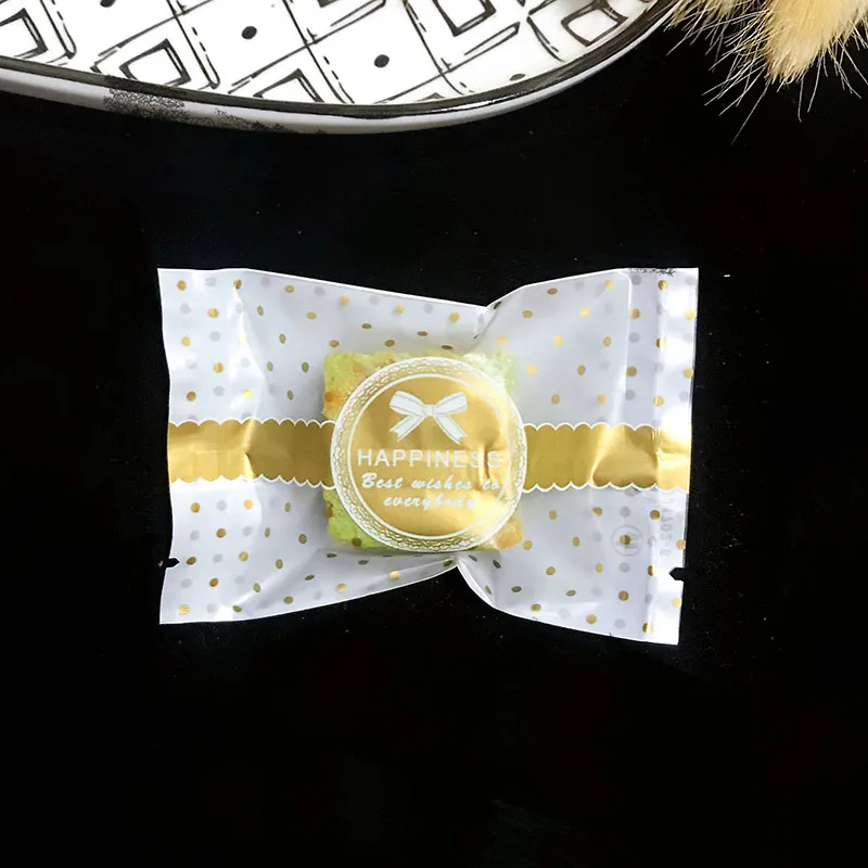 100pcs Noble Golden Little Dot Bow Transparent Snowflake Crispy Seal Plastic Bag Watch Shape Bar Party Candy Gift Nougat Pack