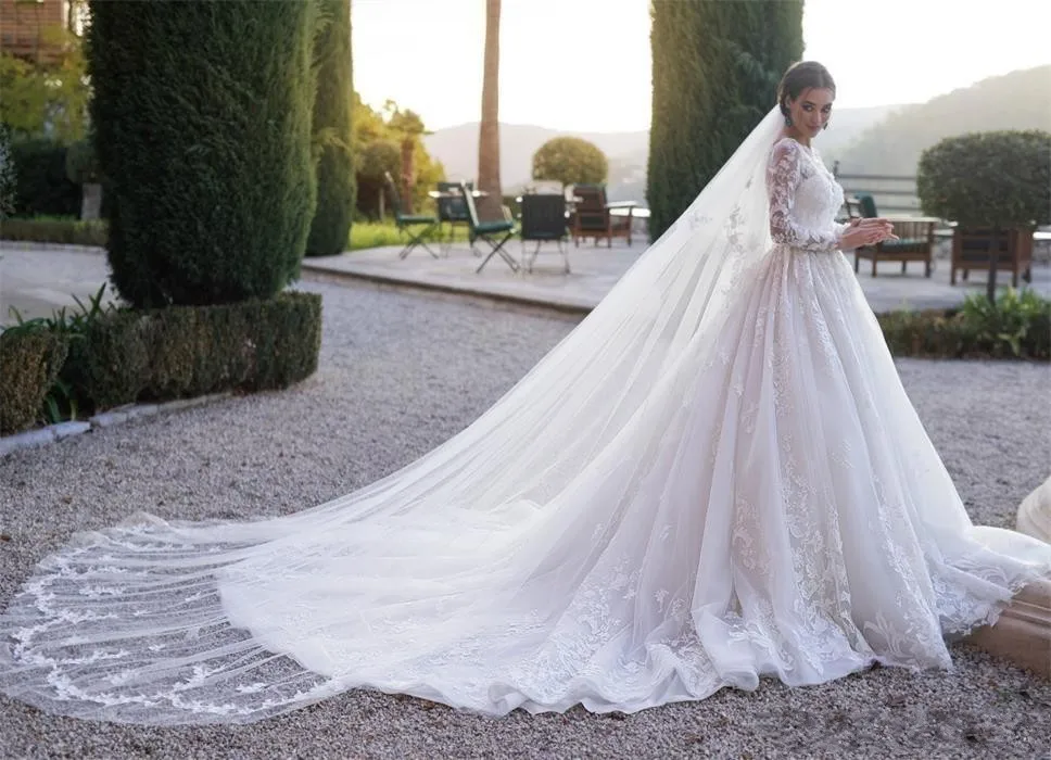 Abiti da sposa A maniche lunghe in pizzo modesto arabo musulmano una linea collo trasparente Appliqued increspato abiti da sposa lunghi formali su misura