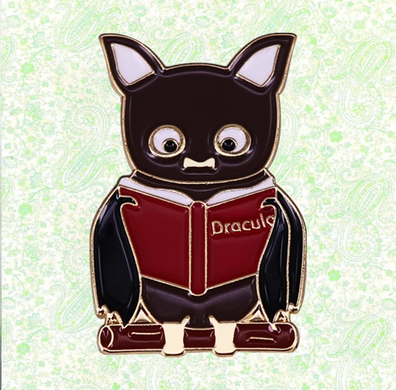 Cute bat reading Dracula book Enamel Pin Bram Stoker Gothic horror novel Vampire brooch