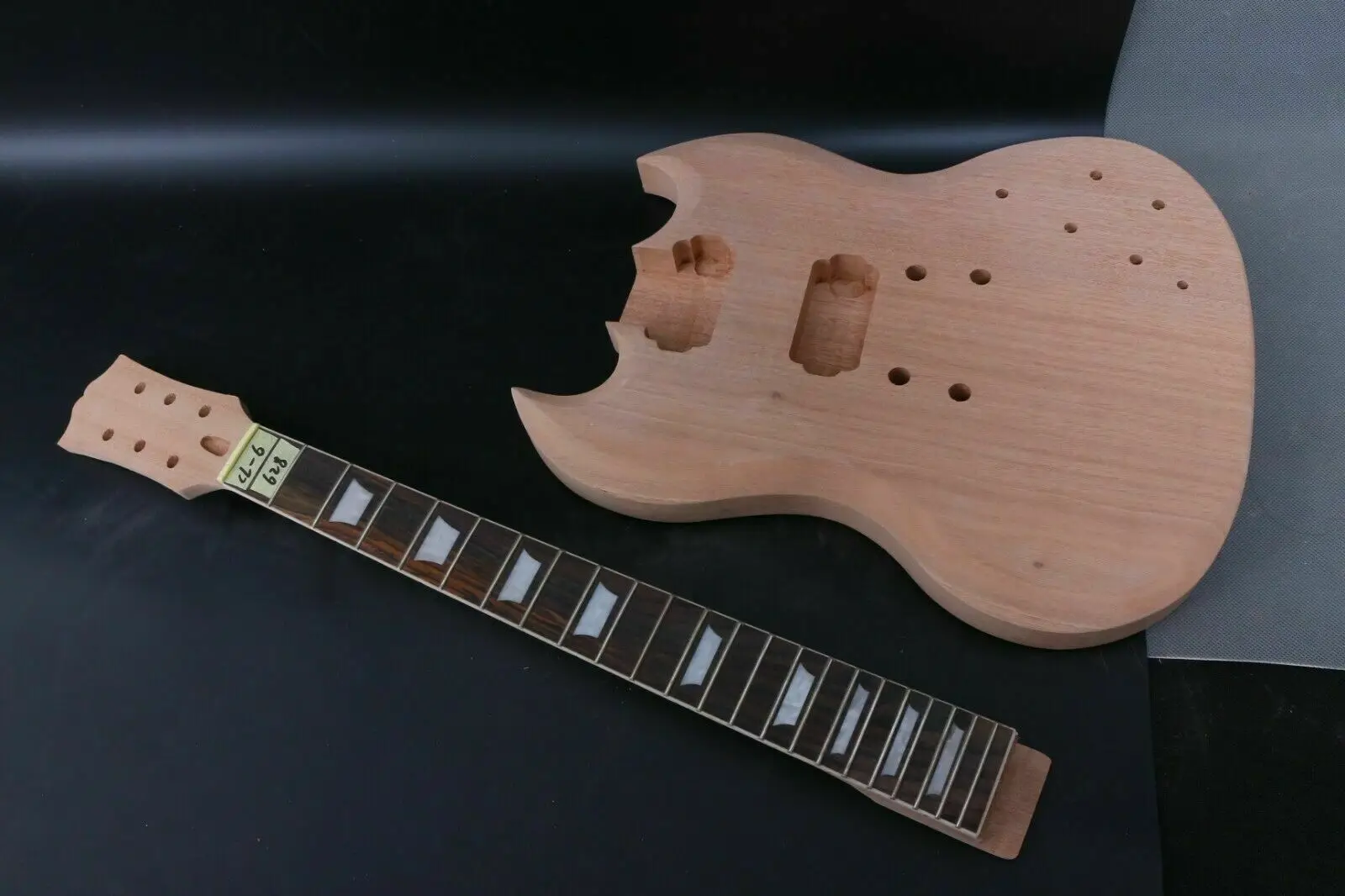 

1 set New guitar neck + Unfinished Guitar Body with Mahogany wood HH Style pickup holes. Set in heel Fit for the