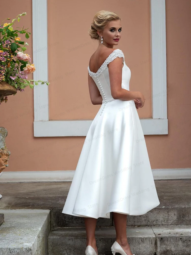 Vestido de novia corto de satén, prenda sencilla hasta la rodilla con cuentas de cristal y bolsillo, elegante, con manga de casquillo festoneado, 202