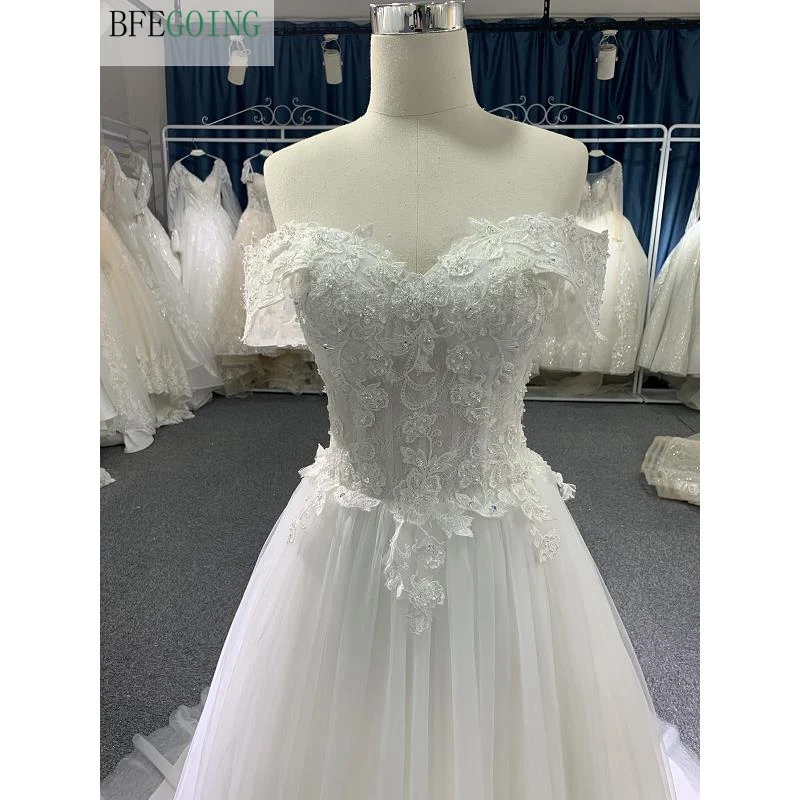 Vestidos de novia de encaje de marfil, vestidos de novia de línea a, longitud hasta el suelo, con cuentas y hombros descubiertos, con forma de corona Tran, con escote Corazón, hechos a medida