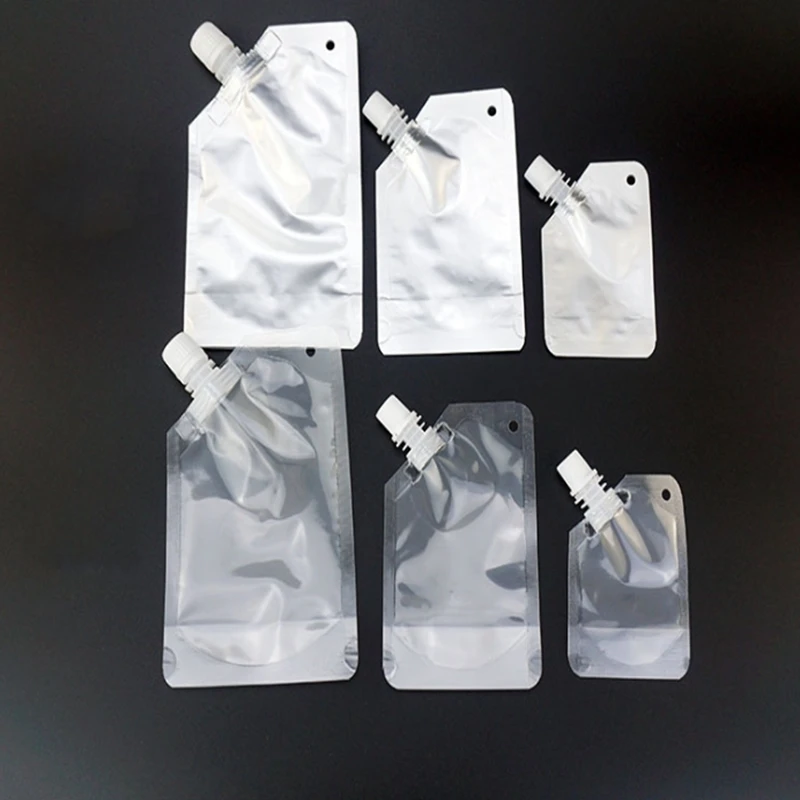 

1000pcs/lot 50ml 100ml 250ml 500ml Empty Stand up Plastic Drink Spout Bag transparent and foil Self-standing suction bags