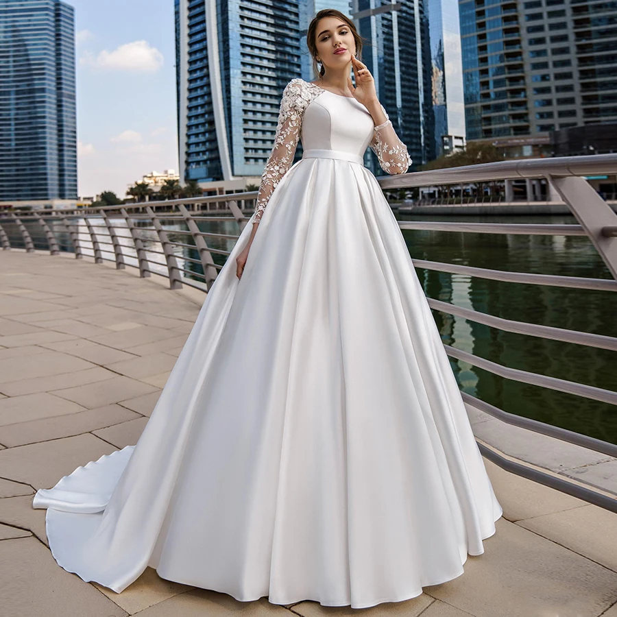 Elegante con abito da sposa musulmano in raso tascabile maniche lunghe scollo tondo Applique in pizzo abiti da sposa A-line Vestido De Novia