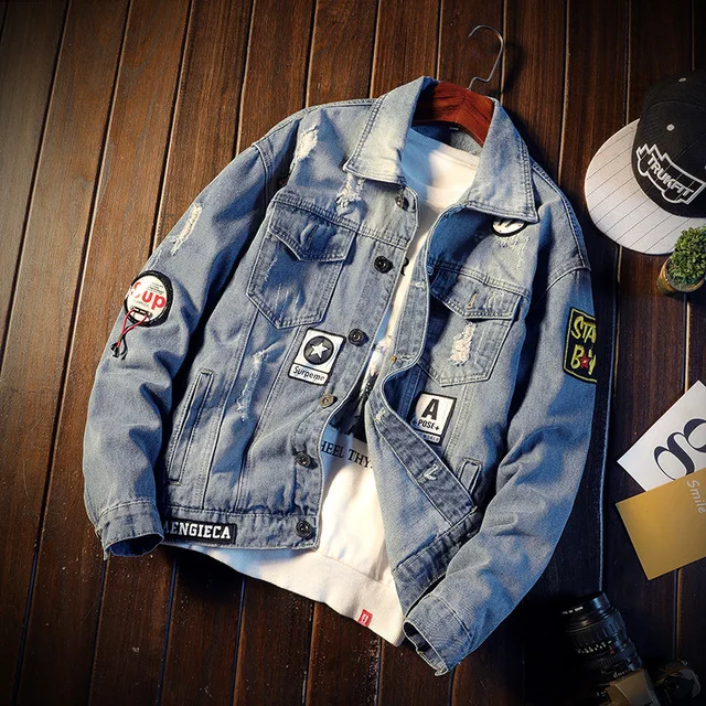 

Men Holes Jean Jackets Light Blue Denim Jackets And Coats High Quality Men Cotton Loose Denim Coats Printing Badge Casual Coats