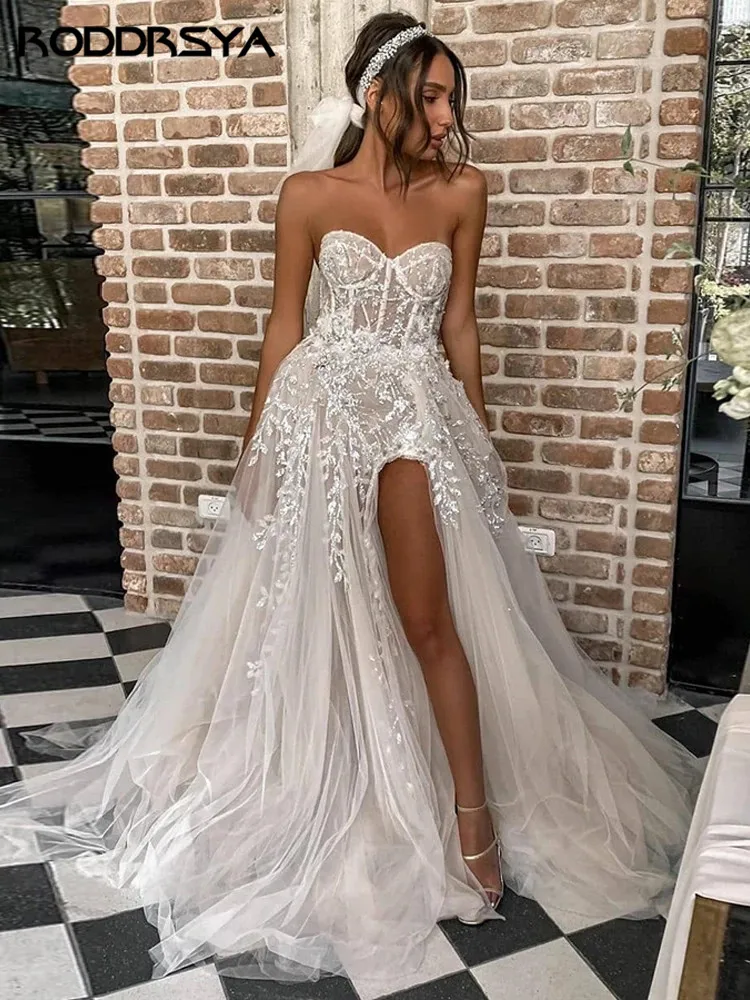 RODDRSYA Strand Brautkleider Für Braut Elegante Spitze Boho Brautkleider Trägerlos ÄrmellRoddrsya Strand Brautkleider für Braut elegante Spitze Boho Brautkleider träger lose ärmellose High Split Prinzessin Brautkleider