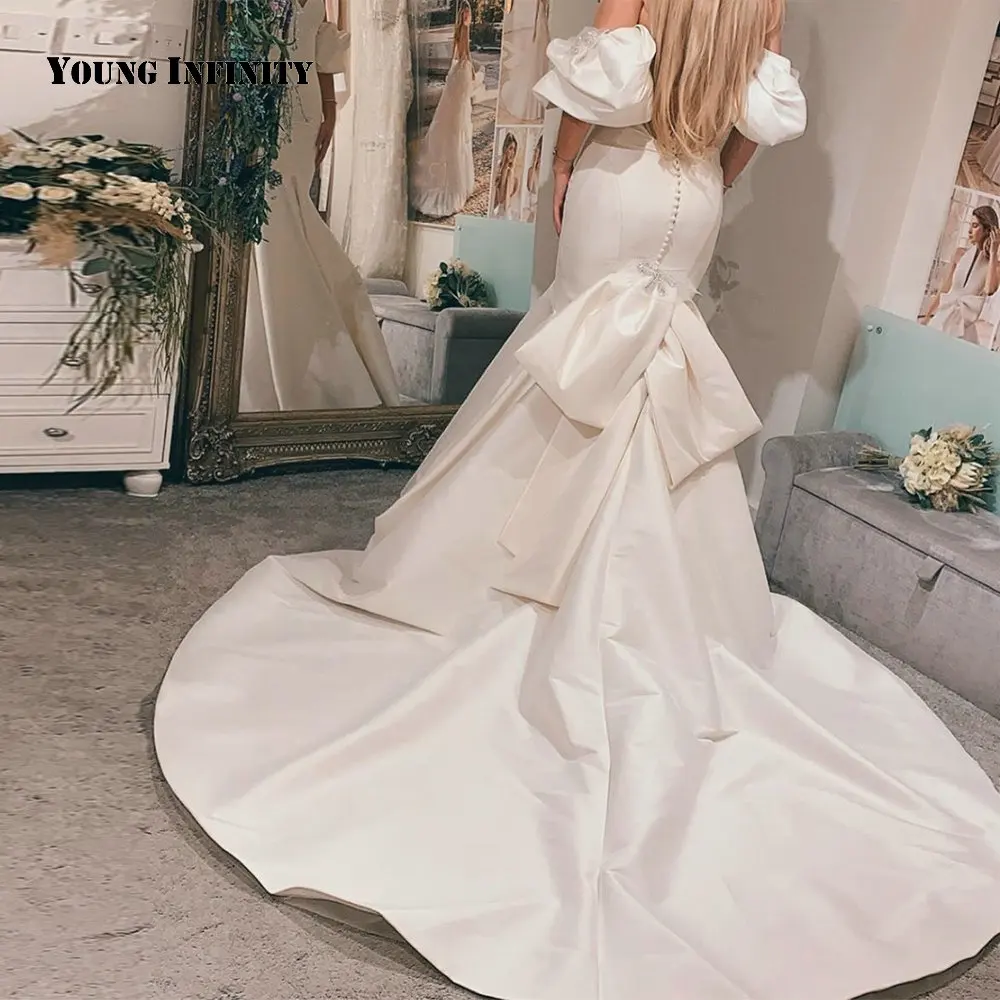 New Arrival Sweetheart Wedding Dress 2021 Satin Puff Sleeve Button Bow Court Train Floor Length Backless Mermaid Bridal Gown