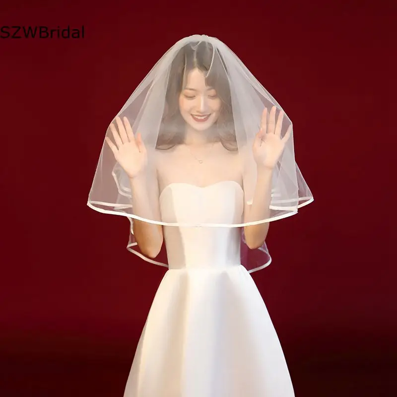 Nieuwe Collectie Welon Ivoor Bruiloft Sluier Mariage Korte Bridal Veils Ribbon Edge Boda Goedkope Bruiloft Accessoires Sluier Bruiloft