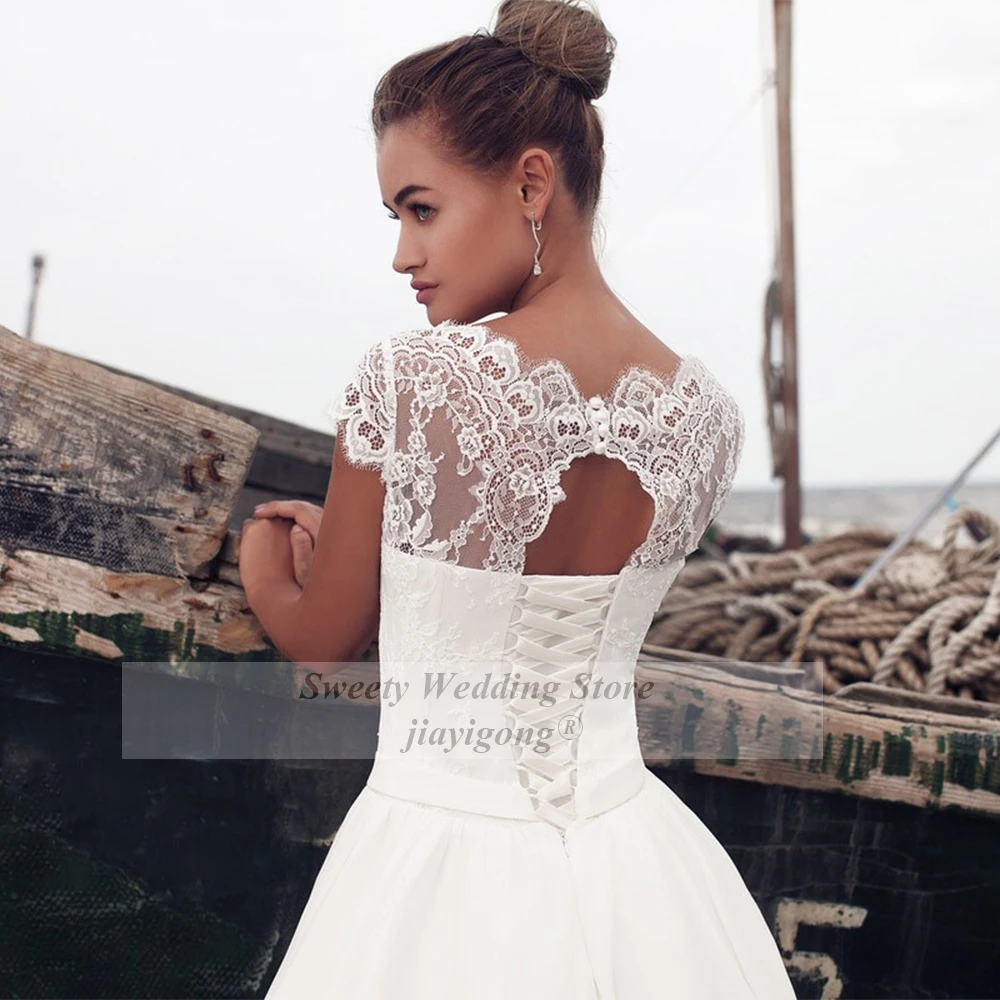 Sexy Boho Hochzeit Kleid Günstige Strand Brautkleider Mit Kurzen Ärmeln O Neck Spitze EINE Linie Bodenlangen Zurück Spitze-up Brautkleider