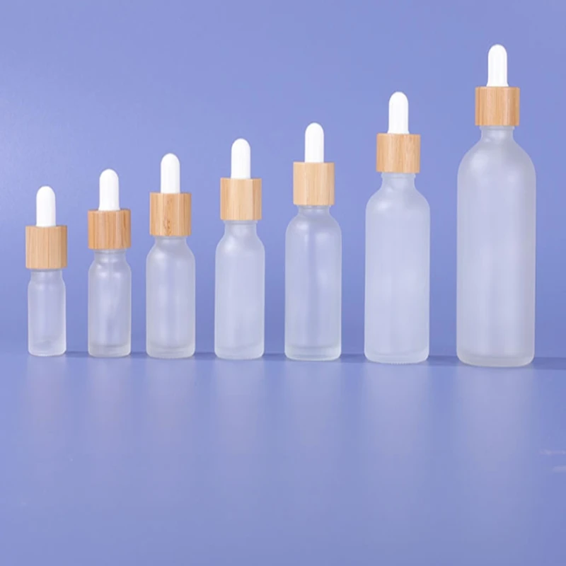 

100pcs 5ml 10ml 15ml 20ml 30ml 50ml 100ml Frosted Clear Glass Dropper Bottle with Bamboo Lid Cap Essential Oil Glass Bottles