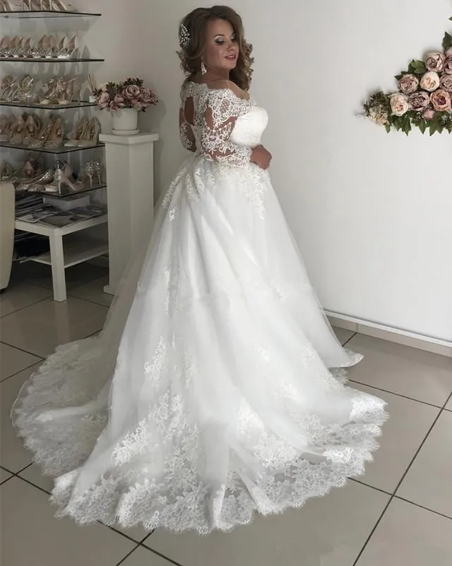 2025 Vestidos de novia de talla grande Cuello transparente Manga larga Encaje Espalda hueca Jardín País Vestidos de novia Robe De Mariage Personalizado