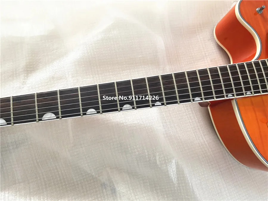 High quality custom version of jazz double F hole orange electric guitar gold large rocker vibrato