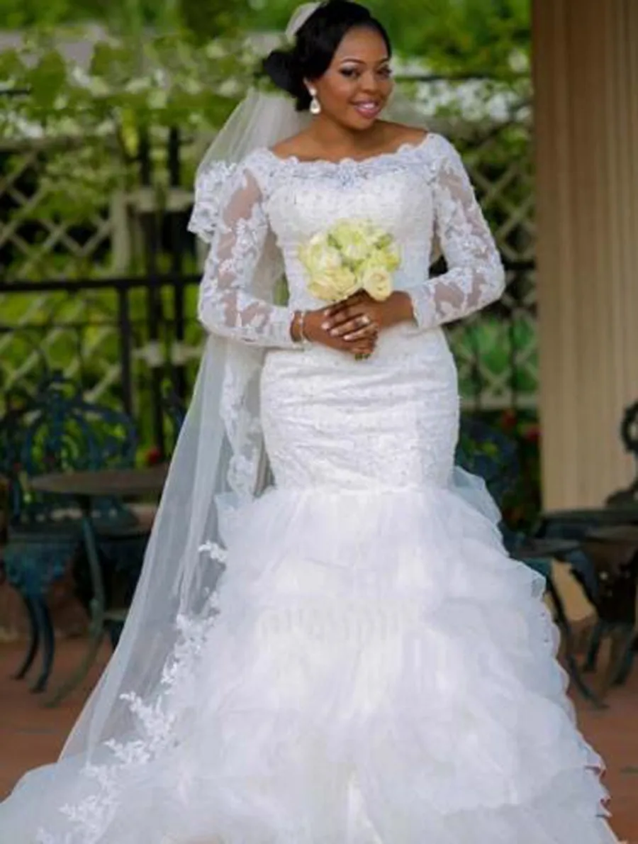 

Long sleeve Appliques African Mermaid Wedding Gown Tiered Boat Neck White Color Beading Mermaid Wedding Dress