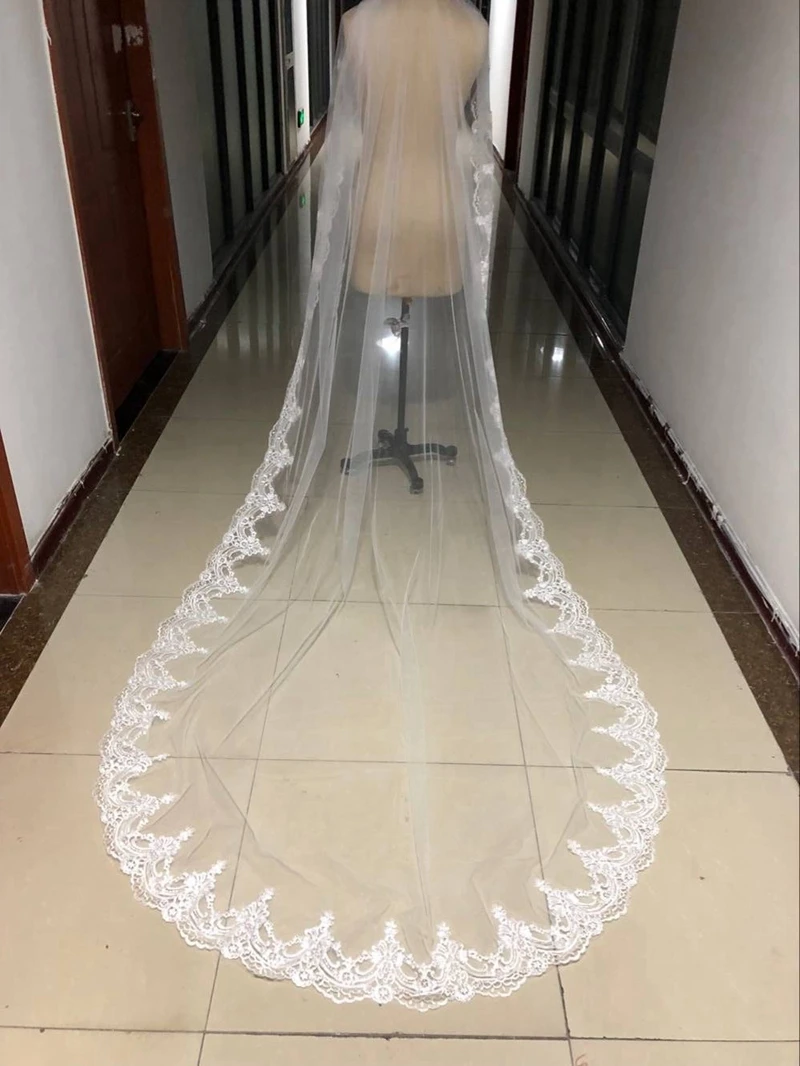 新着一層ロングブライダルベールレースエッジウェロンボダカサメントウェディングベールウェディングアクセサリーベロダスポサ