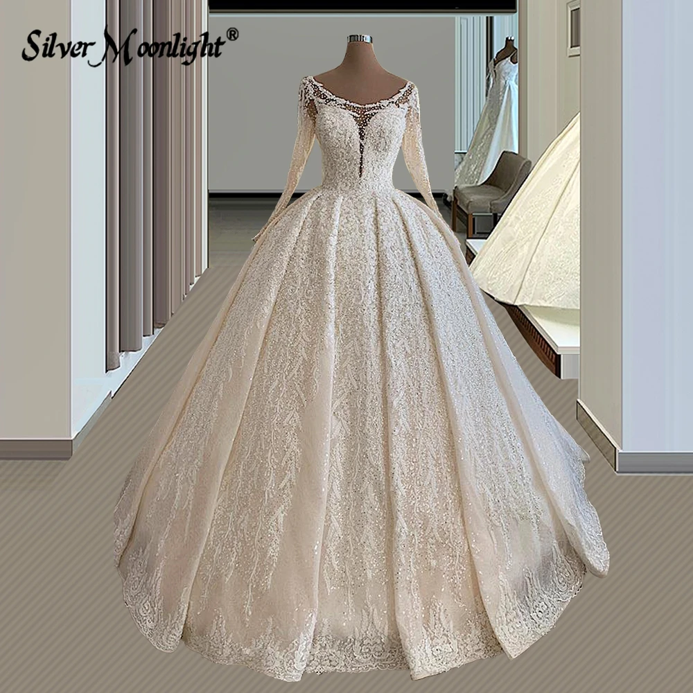 Vestidos de novia de encaje de línea A de manga larga con perlas, elegante cuello redondo, apliques de cuentas completas, tren de corte, vestido de novia Vintage árabe