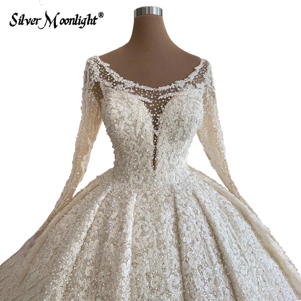 Vestidos de novia de encaje de línea A de manga larga con perlas, elegante cuello redondo, apliques de cuentas completas, tren de corte, vestido de novia Vintage árabe