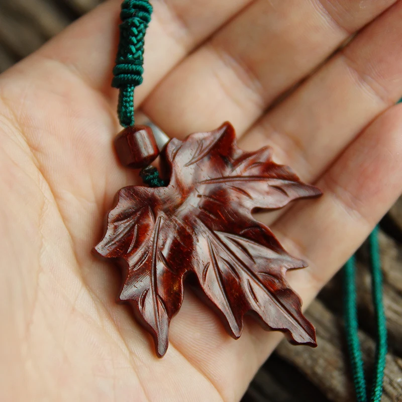 Hand-Carved Red Maple Leaf Feng Shui Pendant - Exquisite Wooden Sculpture with Hanging Strap, Perfect for Elegant Home Decor