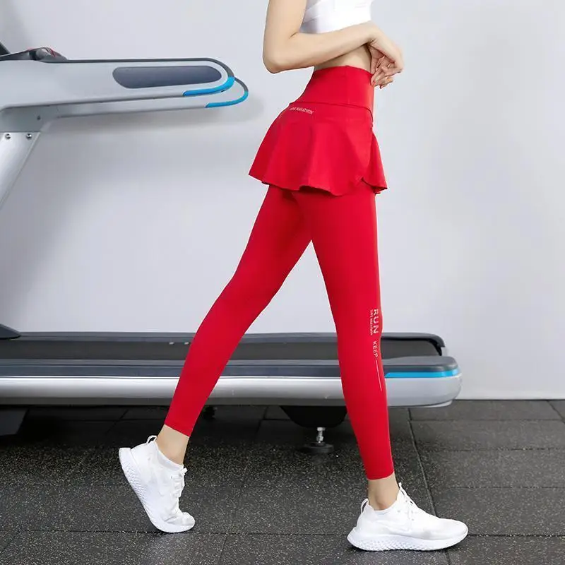 Legginsy z wysokim stanem Nylon Elastyczność Odzież gimnastyczna Trening Bieganie Odzież sportowa Spodnie do jogi Podnoszenie bioder Trening Fałszywe dwie spódnice + spodnie
