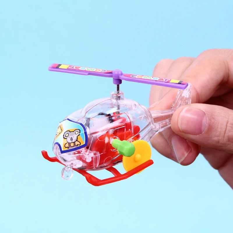 New and interesting wind-up clockwork toy transparent mini airplane helicopter pull-back toy child infant crawling toy