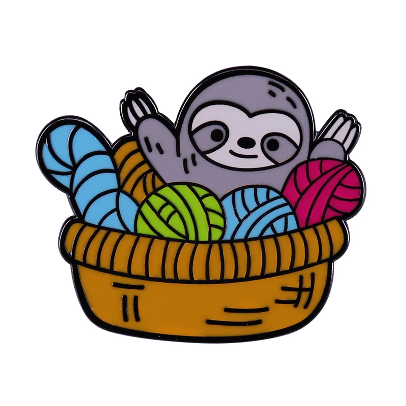 Brighten up your day with this cheeky sloth in a yarn basket enamel pin! Perfect for knitting lovers yarn hoarders and crafters!