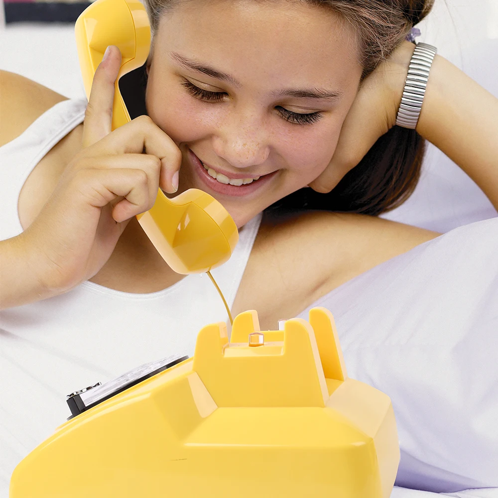 Retro corded telephone, landline telephone, office/home decorative item, classic black rotary dial audio.