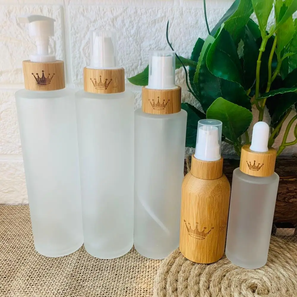 

30ml 50ml 100ml 120ml 150ml lotion bottles matte glass bottles empty cosmetic packaging with engraving logo bamboo lid cap