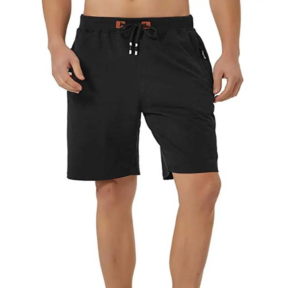 man Shorts Quick dry Elastic band Drawstring pocket solid color beach pants loose Shorts summer Breathable men Shorts