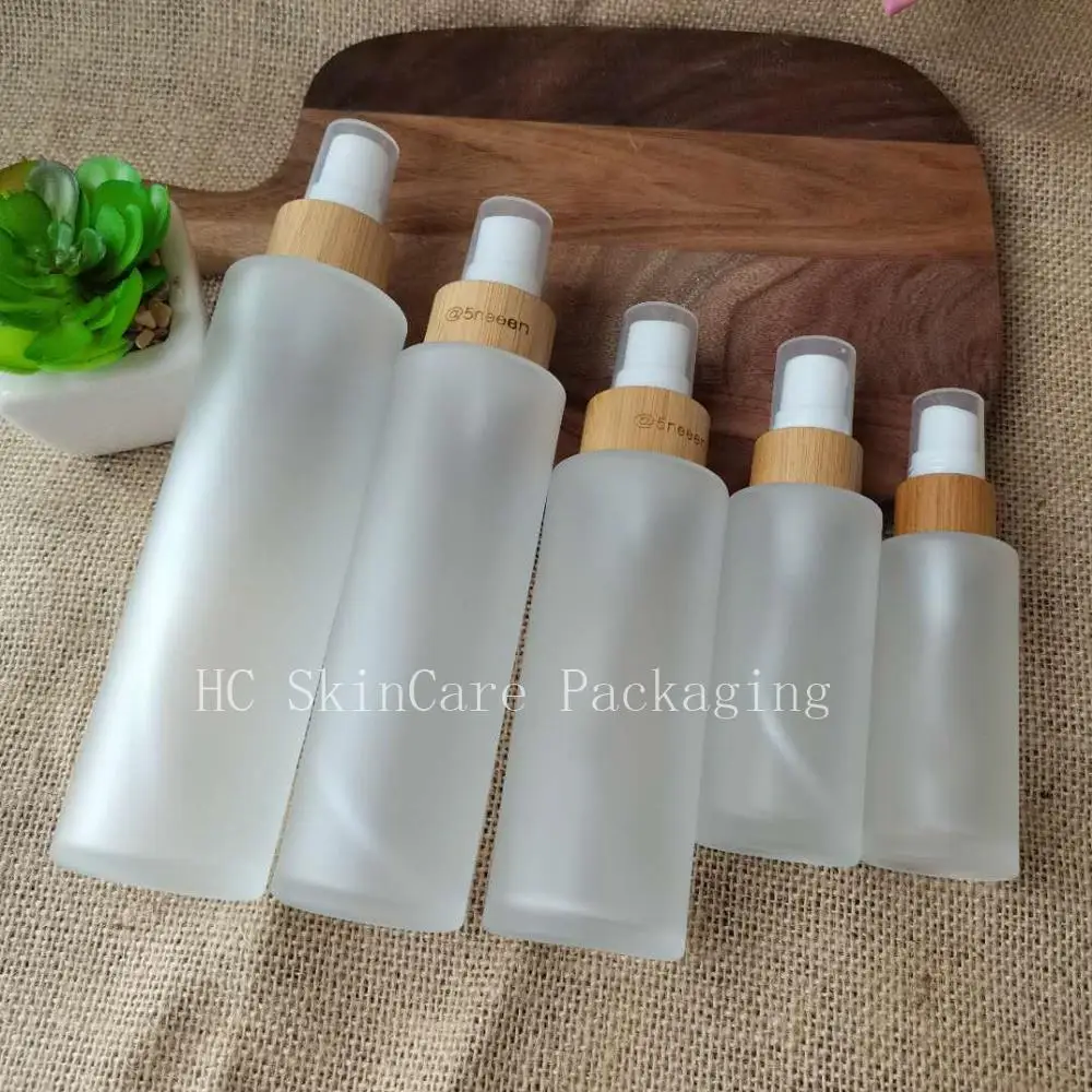 

Wholesale Engraving Logo Frosted Clear Glass Spray Bottles With Bamboo Lid 30ml Glass Spray Bottles