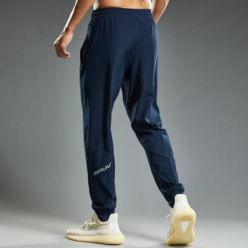 Pantaloni sportivi da uomo pantaloni da corsa con tasche con cerniera allenamento e Jogging pantaloni da uomo pantaloni da palestra per uomo