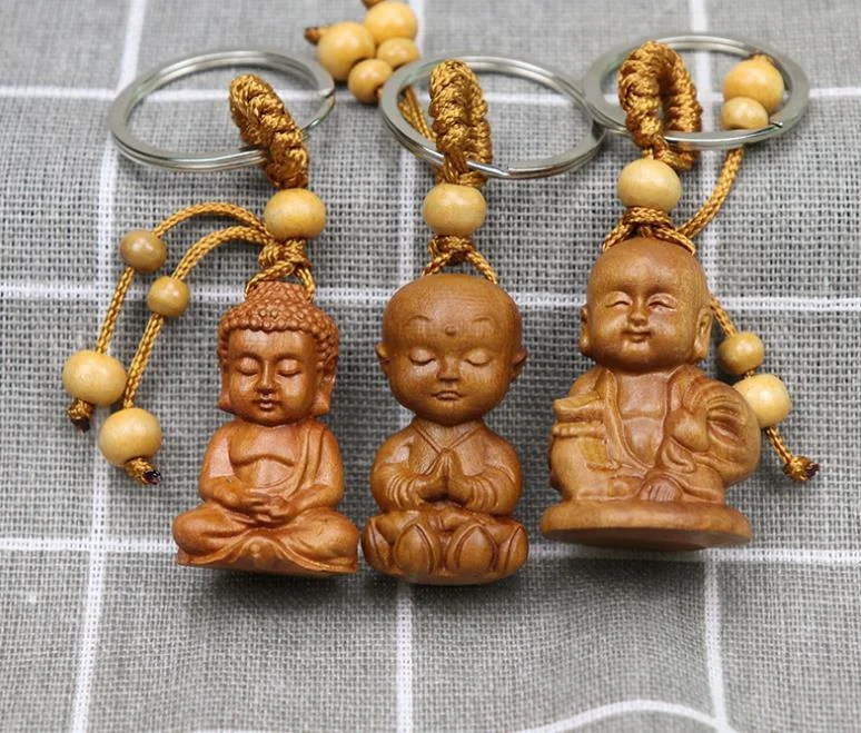 Venta caliente de madera de melocotón tallada Shakyamuni Buda llavero colgante de madera Guanyin Bodhisattva regalo colgante llaveros de Buda