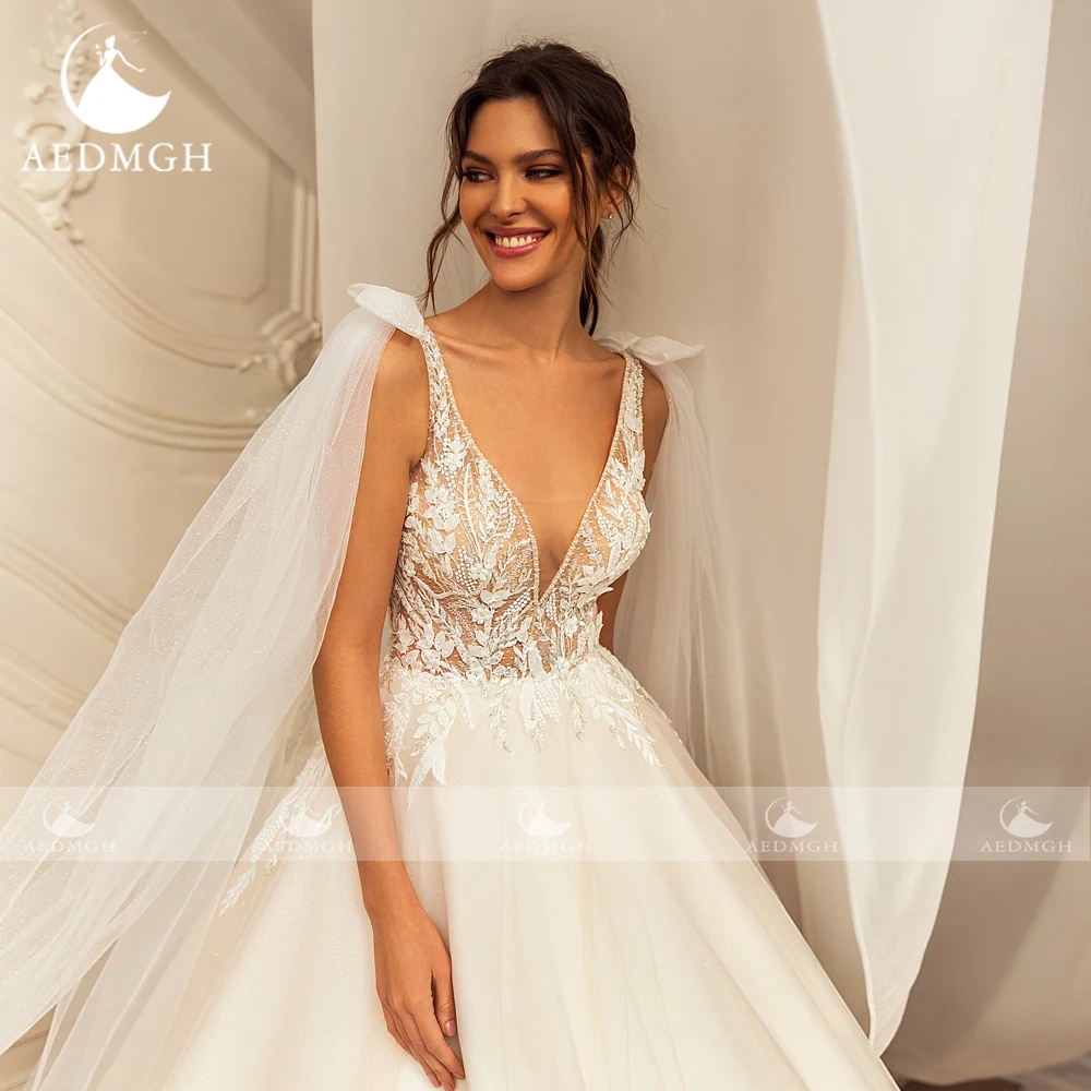 Aedmgh A-Line Abiti da sposa Scollo a V Fiocco senza maniche Lucido Robe De Mariee Perline Applicazioni di pizzo Abito da sposa su misura di lusso