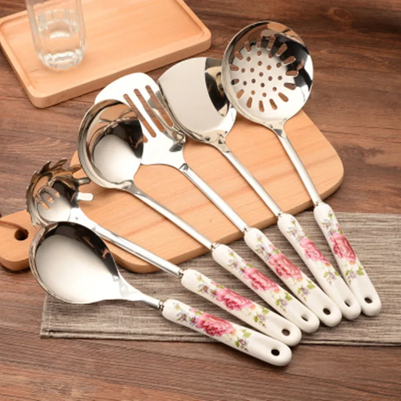 

7pcs Ceramic Handles Cooking Tool Set Stainless steel Kitchen Utensils set of cookers Stir-fry Shovels Spoons Strainer Spatula