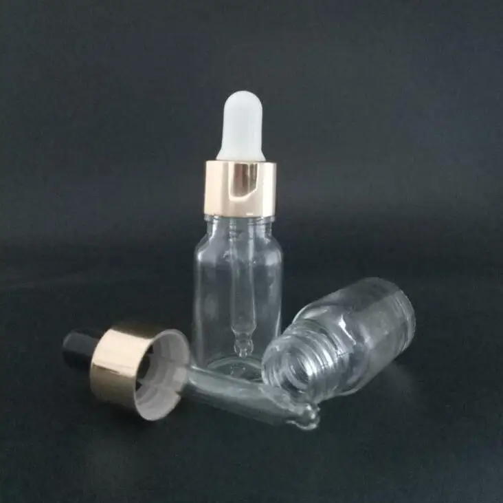 

Empty 10ml Clear Glass Droppers bottles Mini Glass essential Oil bottle Vials With Glass Pipete And Gold Childproof Cap LX1093