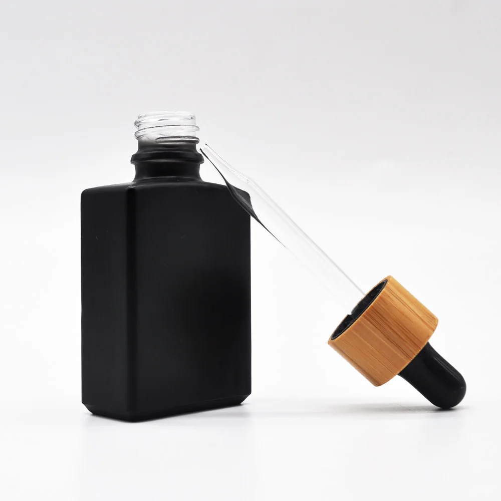 

CBD natural matte green blue black rectangle white square frosted glass dropper bottle with wooden cap for essential oil 1oz