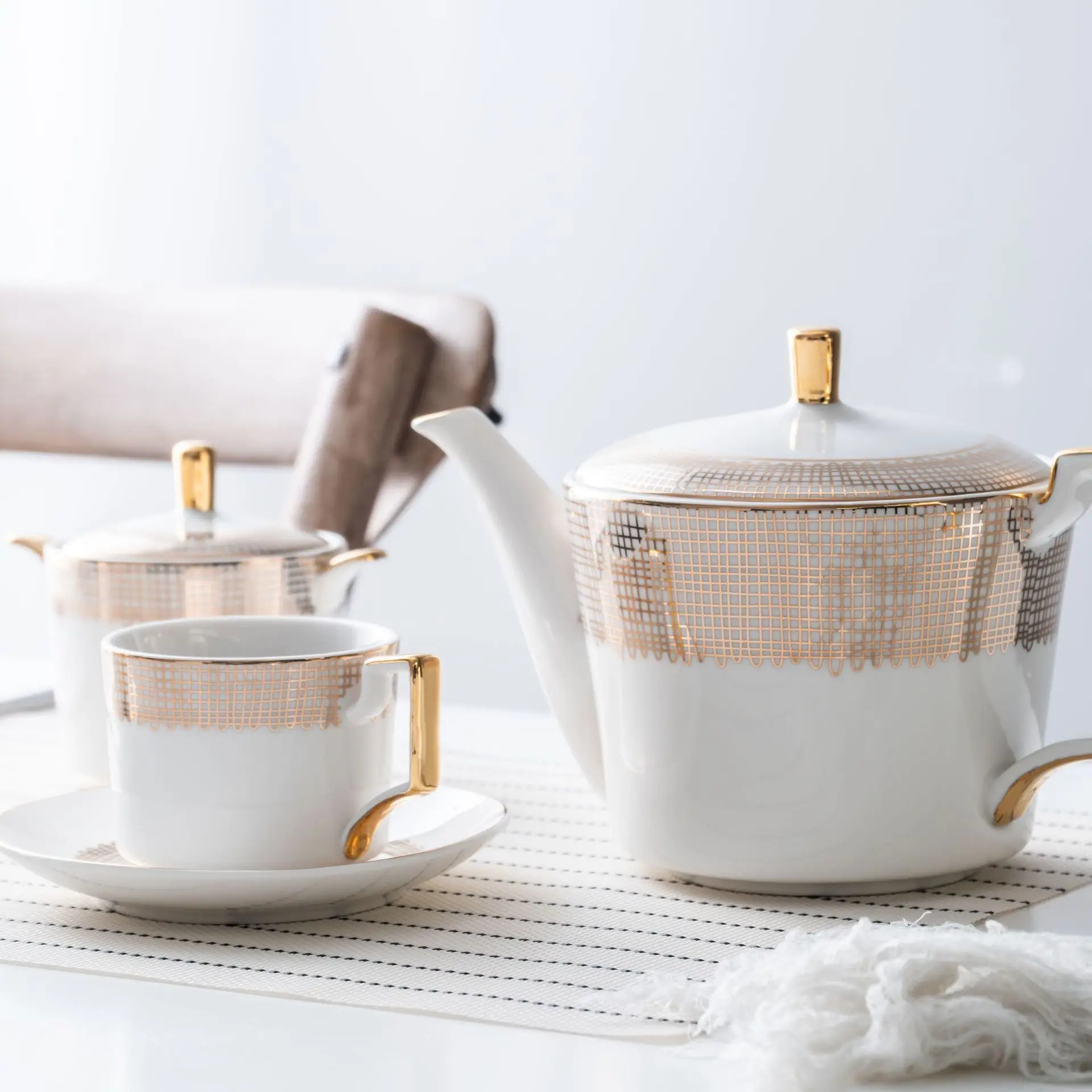 Ceramic tea set white background gold net low bone porcelain coffee cup set creative afternoon tea black tea cup