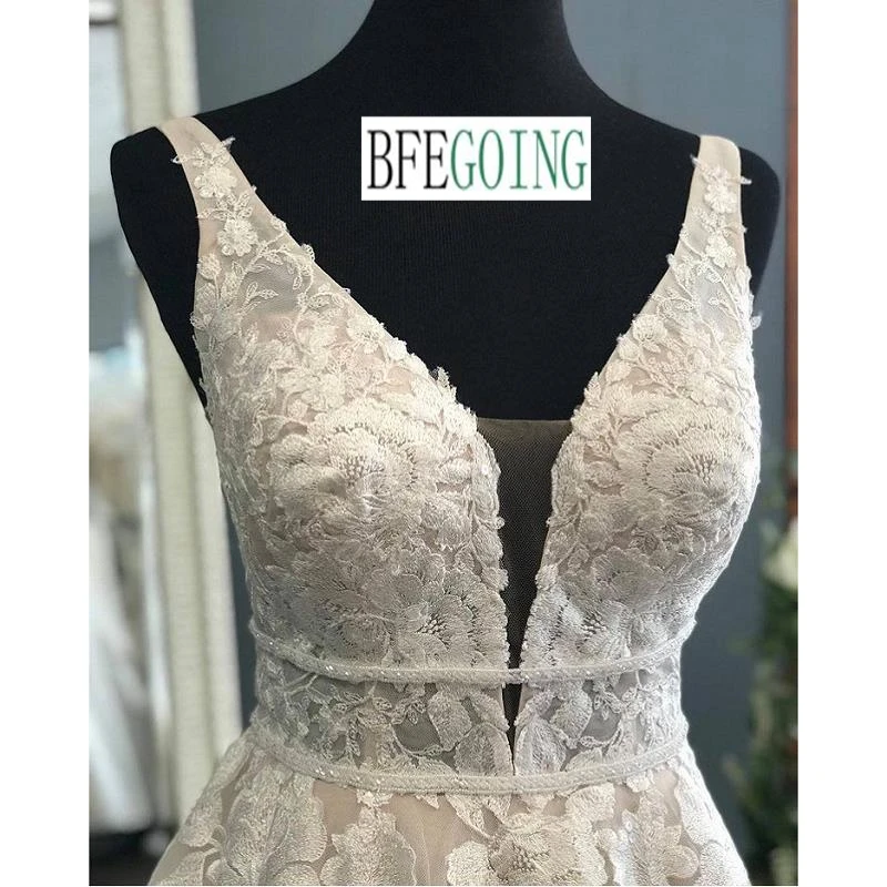 Rendas de luxo beading tule organza v-neck sem mangas a linha vestidos de casamento capela trem vestidos de noiva feitos sob encomenda