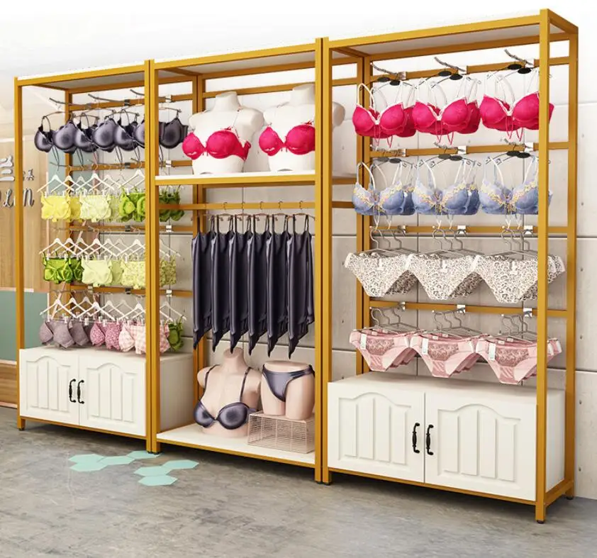 

Underwear store display stand against the wall bra is hanging on the side of the floor clothing store shelf