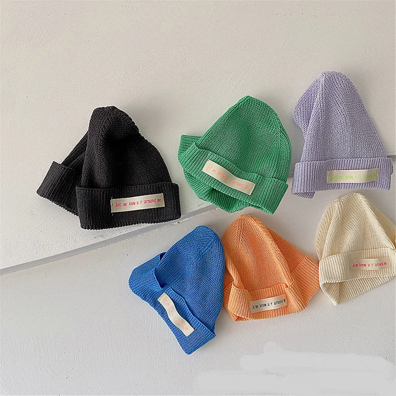 

Korean children's knitted hat melon skin hat candy color letter cloth label baby's concave curled wool hat