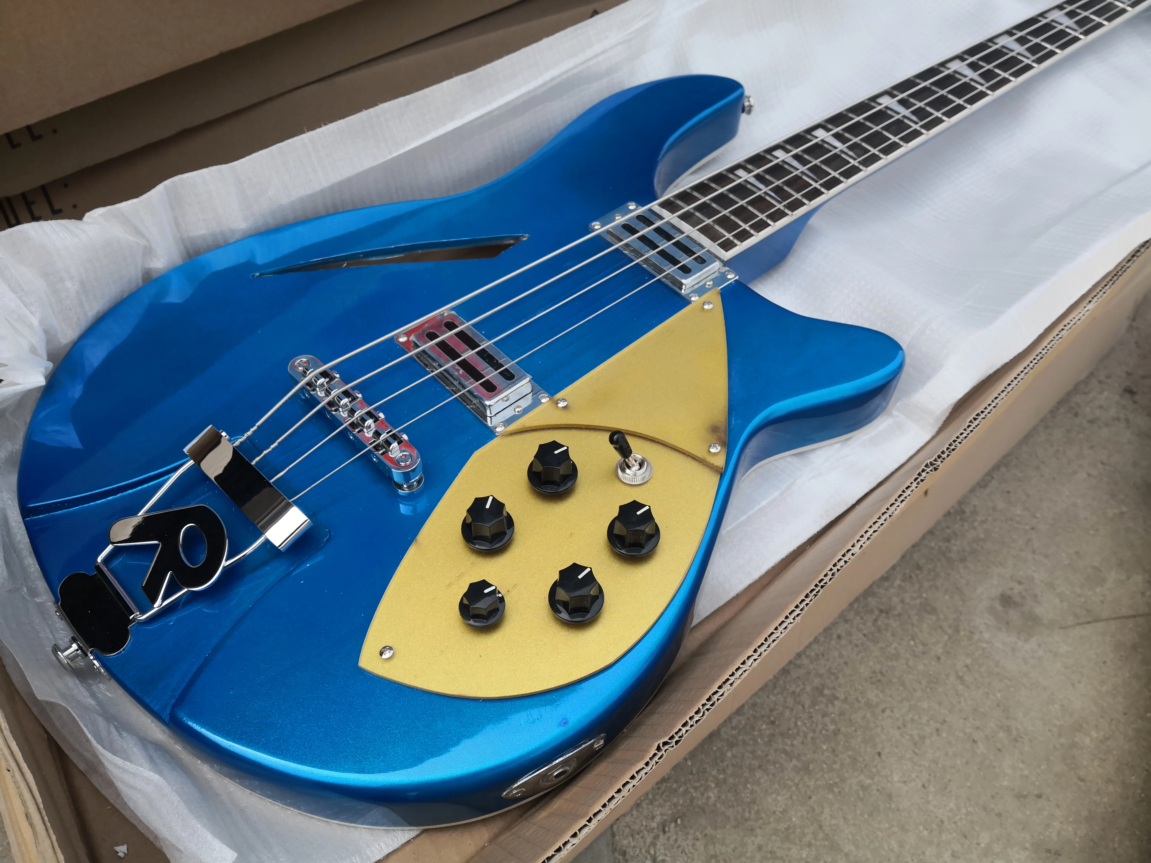 

custom 4 string bass guitar,360 350 semi hollow,metal blue,independent bridge, maple frets,pearl inlay,gold pickguard